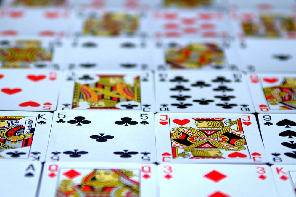 Playing cards laid out on table. Free public domain CC0 image.