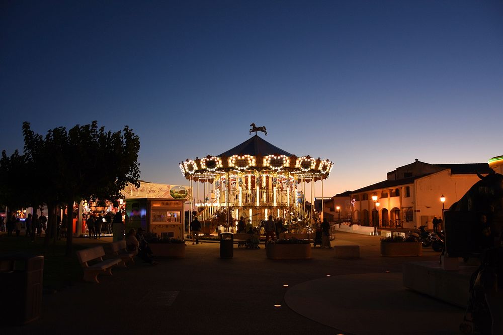 Carousel at amusement park. Free public domain CC0 photo.