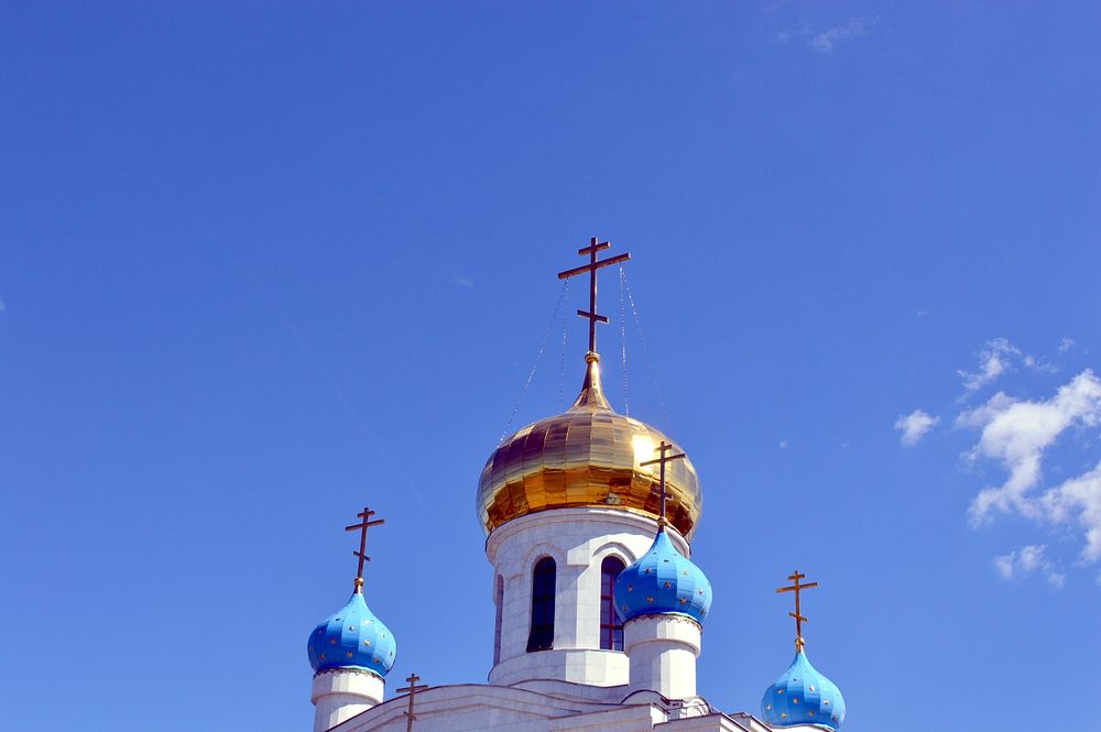 Christian church against blue sky. Free public domain CC0 photo.