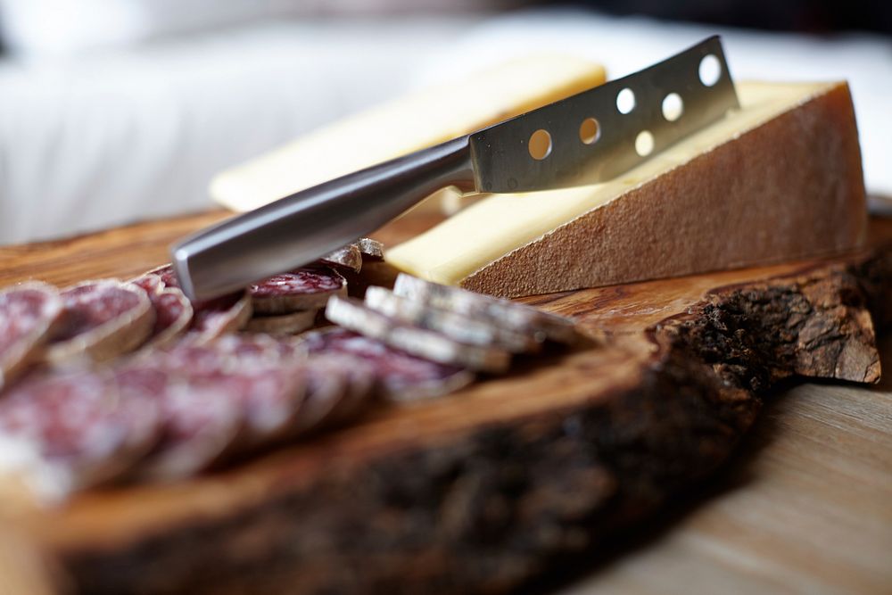 Closeup cheese and meat board snack. Free public domain CC0 image.