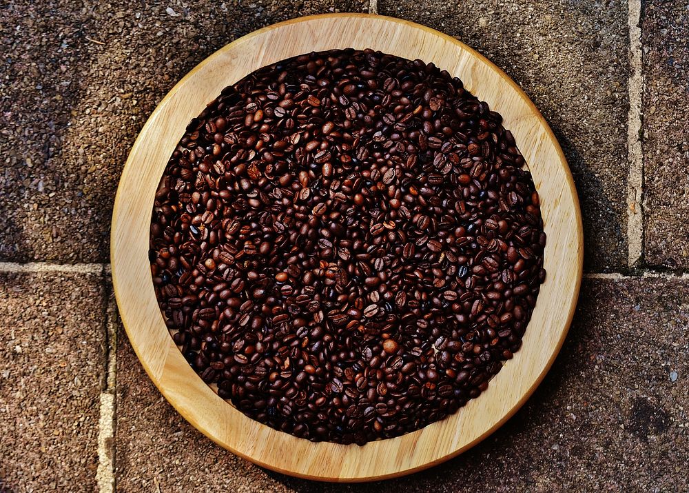 Roasted coffee beans on a plate. Free public domain CC0 photo
