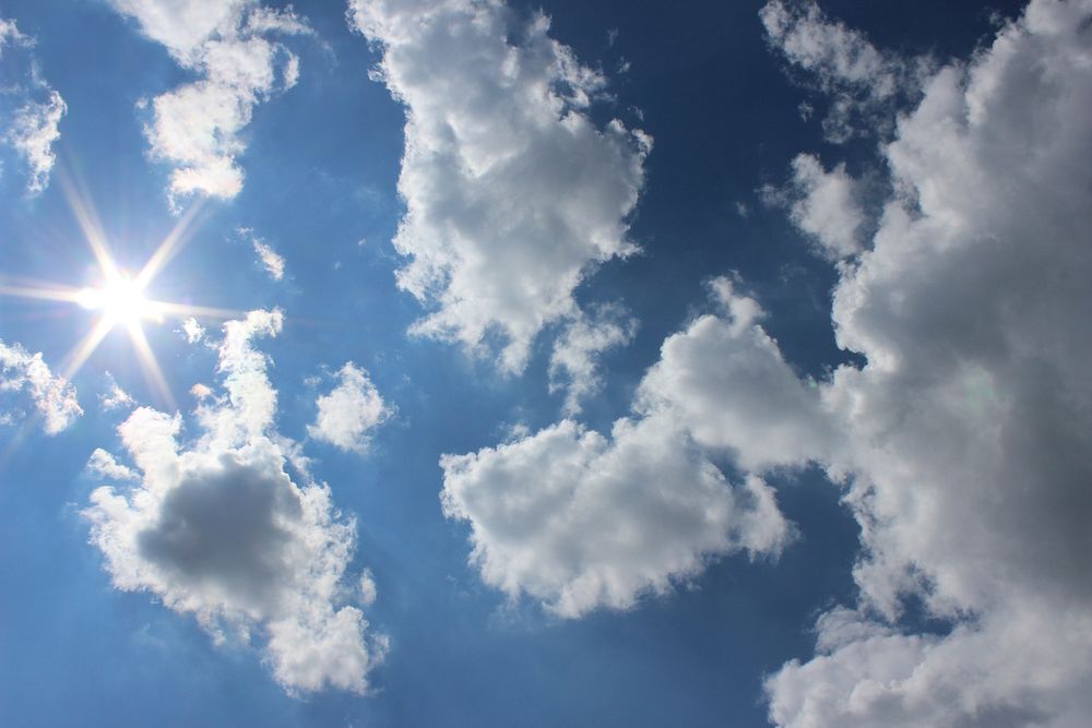 Cloudy sky background, sunbeam. Free public domain CC0 image.