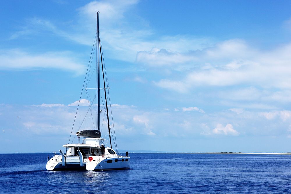 Yacht sailing in the sea. Free public domain CC0 photo.