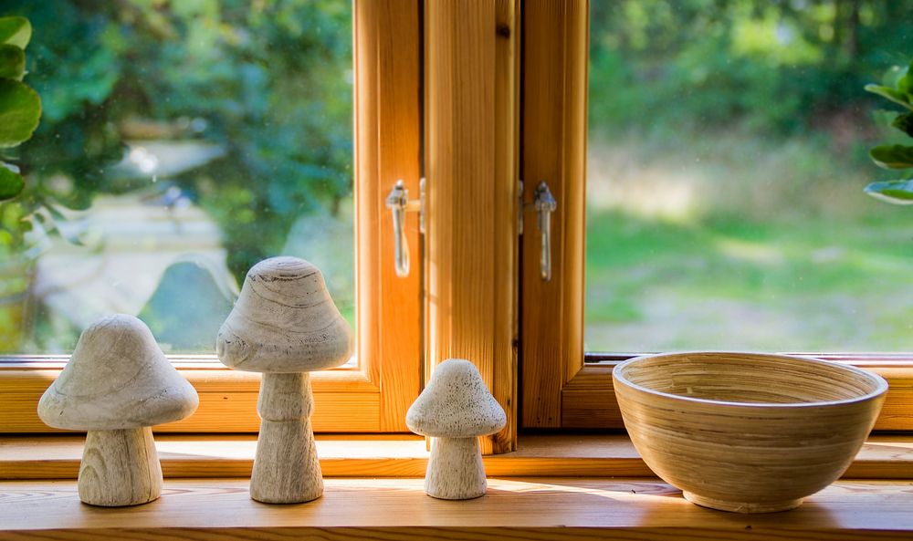 Stone mushrooms, decorations, and bowl by the window. Free public domain CC0 image