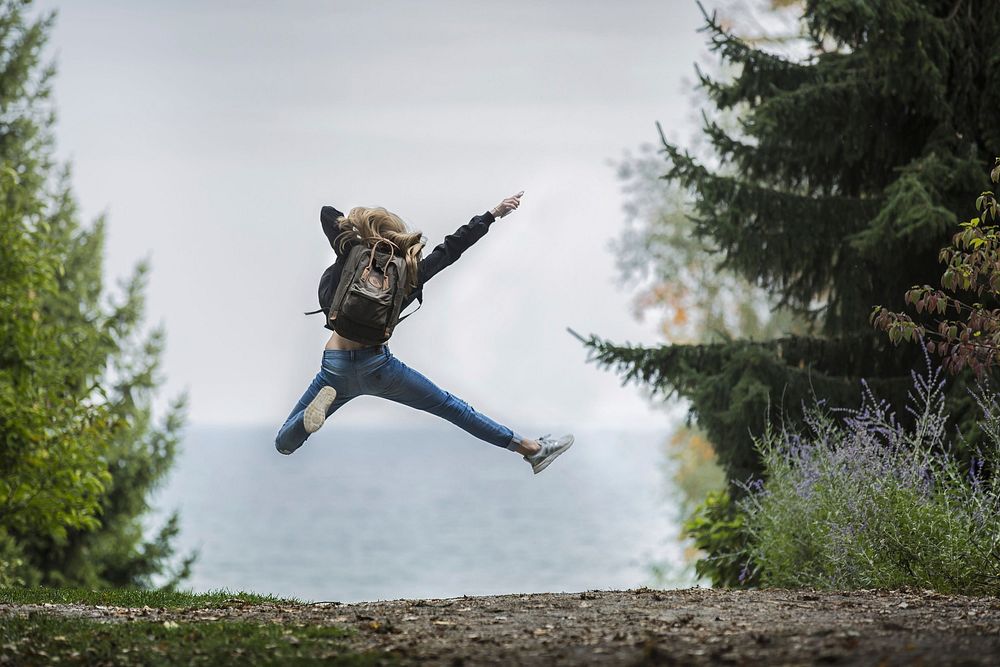 Free girl enjoy jumping outdoors image, public domain people CC0 photo.