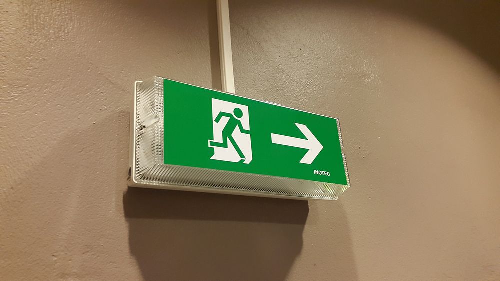 Green emergency exit sign. Free public domain CC0 photo