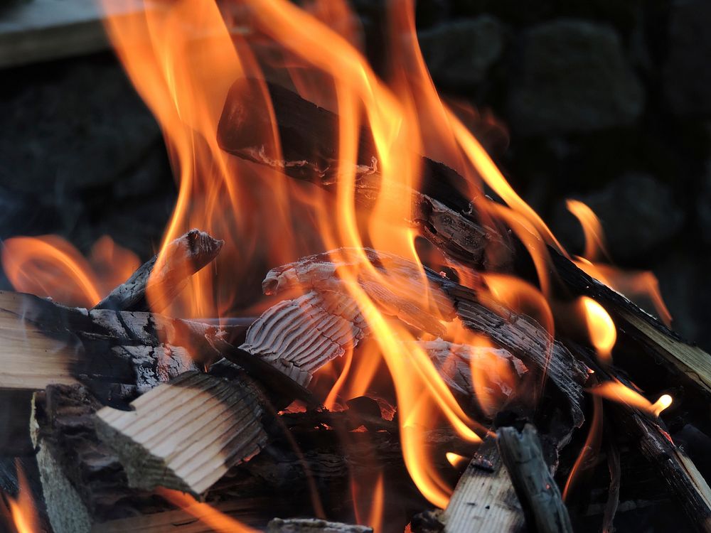 Burning firewood with flame background. Free public domain CC0 photo.