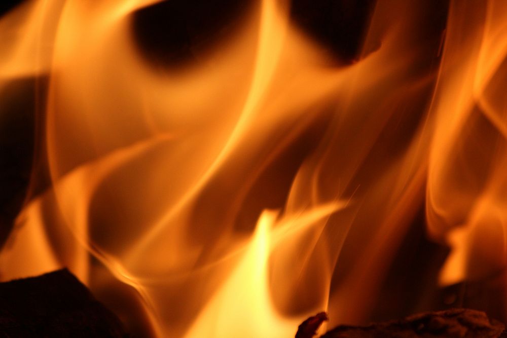 Burning fire, orange background. Free public domain CC0 image.