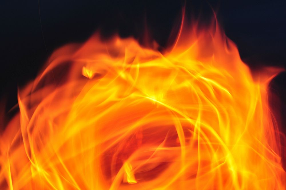 Burning fire, orange background. Free public domain CC0 image.