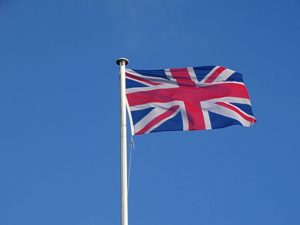 UK flag, blue sky. Free public domain CC0 photo.