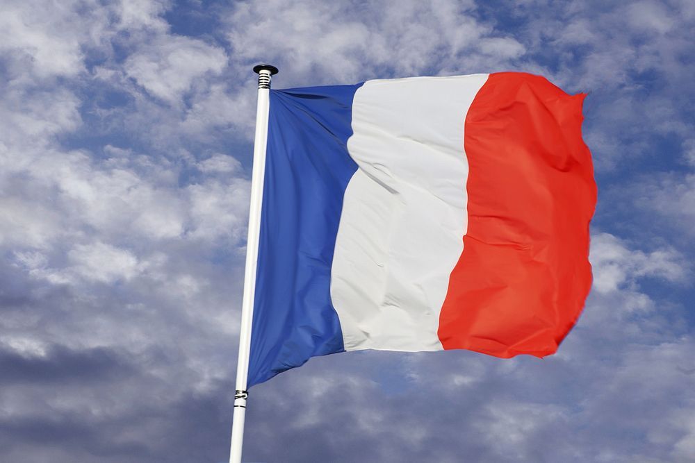 French flag, blue sky. Free public domain CC0 image.