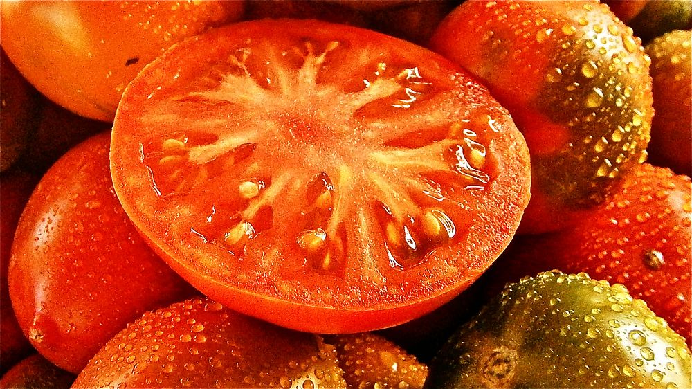 Closeup on sliced tomatoes. Free public domain CC0 image.