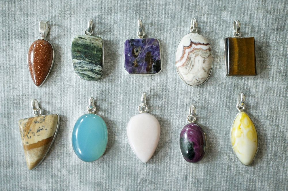 Colorful stone pendants display. Free public domain CC0 image.
