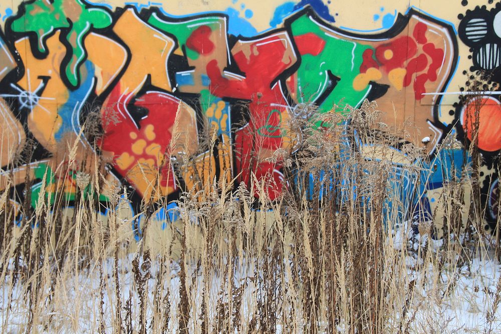 Colorful graffiti on wall outdoors. Free public domain CC0 image.
