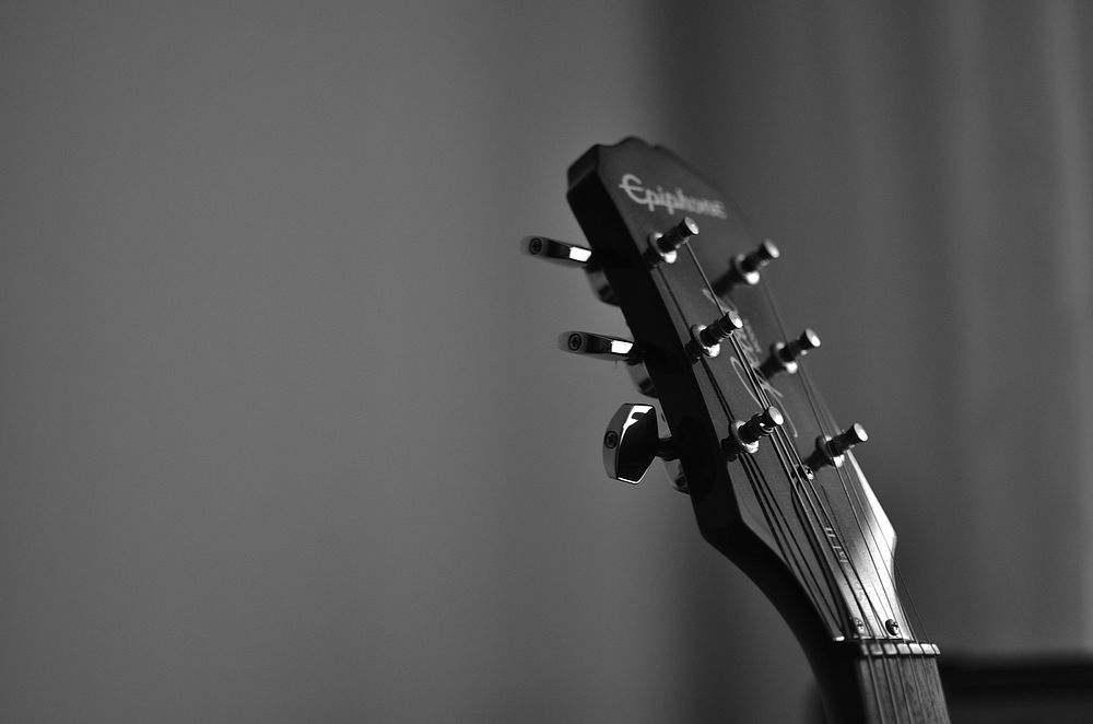 Guitar head, music background.  Free public domain CC0 photo.