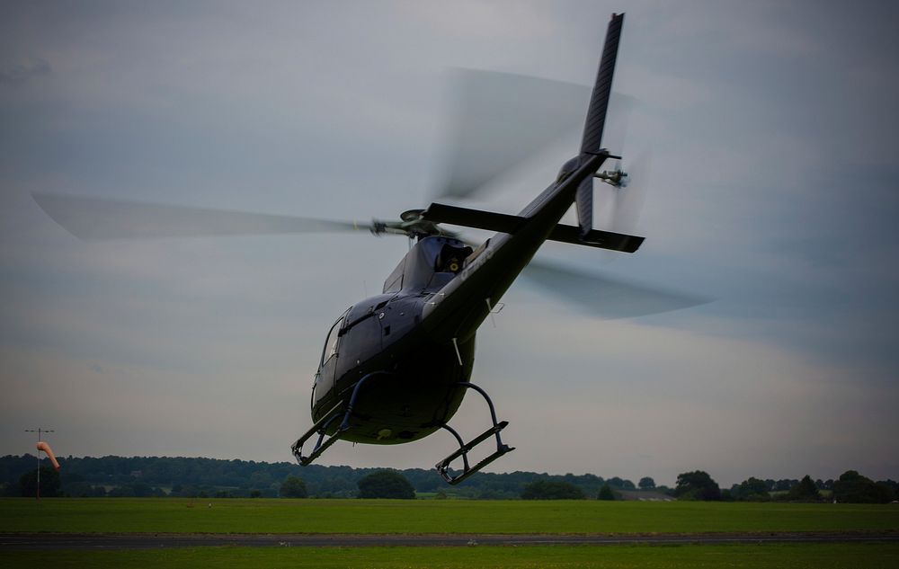 Helicopter landing. Free public domain CC0 photo.