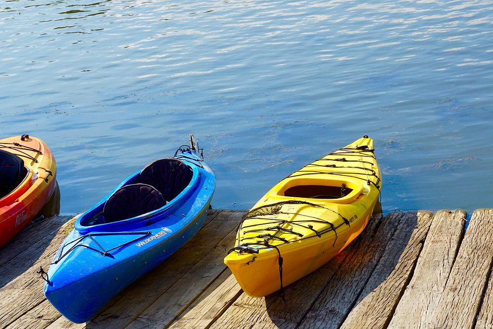 Parked kayak by the water. Free public domain CC0 photo.