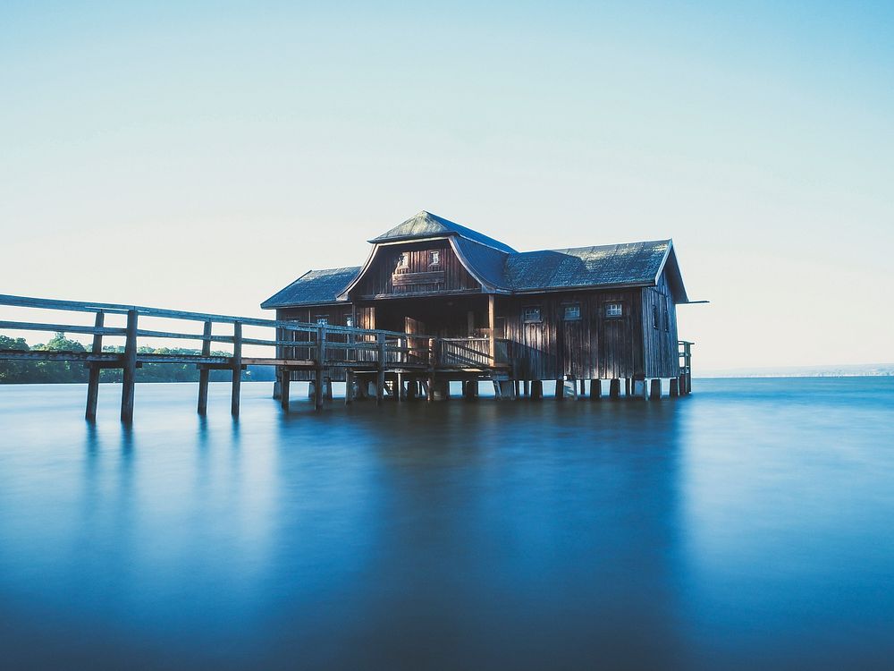 Wooden house in middle of an ocean. Free public domain CC0 image.