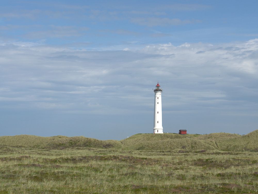 White lighthouse on open field. Free public domain CC0 photo.