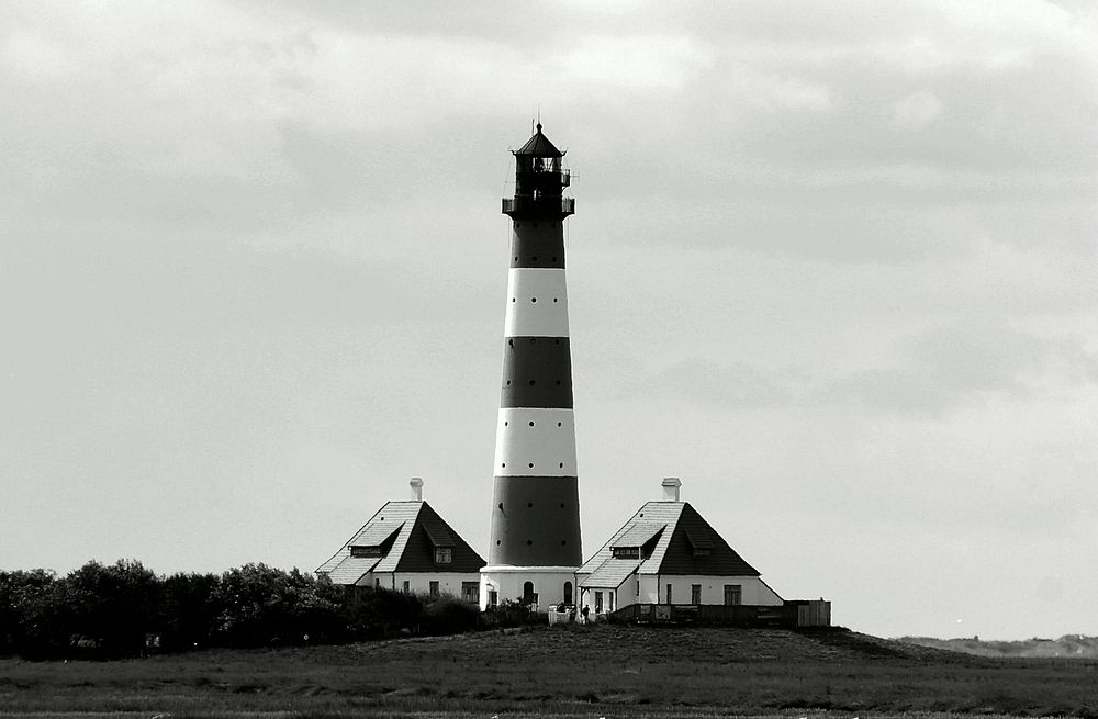 The Westerheversand Lighthouse in black and white. Free public domain CC0 photo.