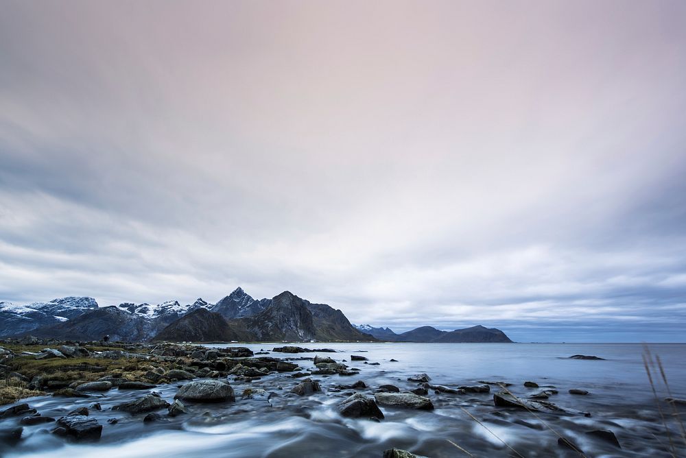 Rocky shore and mountain landscape. Free public domain CC0 photo.