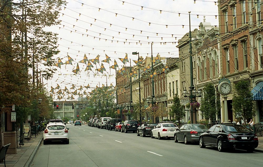 Day view of city market road decorated with garland Lights