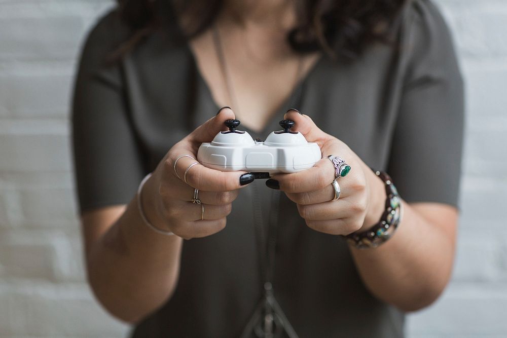 Free close up of woman using a video game controller image, public domain people CC0 photo.