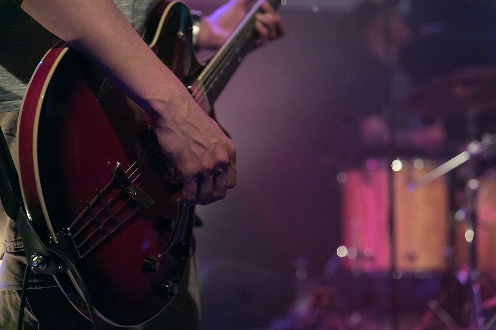 Musician playing guitar, music background.Free public domain CC0 photo.