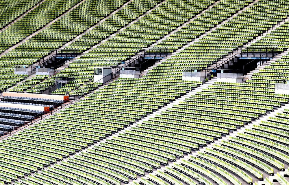 Empty green seats in stadium. Free public domain CC0 image.