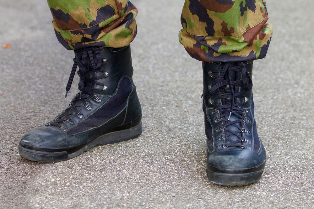 Combat boots on soldier. Free public domain CC0 photo.