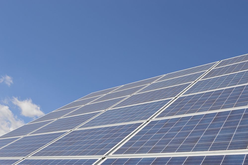 Closeup on solar panels with blue sky. Free public domain CC0 photo.