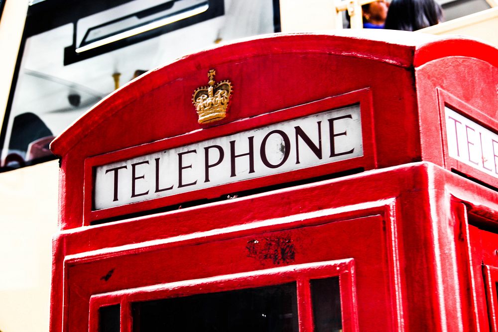 Iconic red phone booth in London, England. Free public domain CC0 photo.