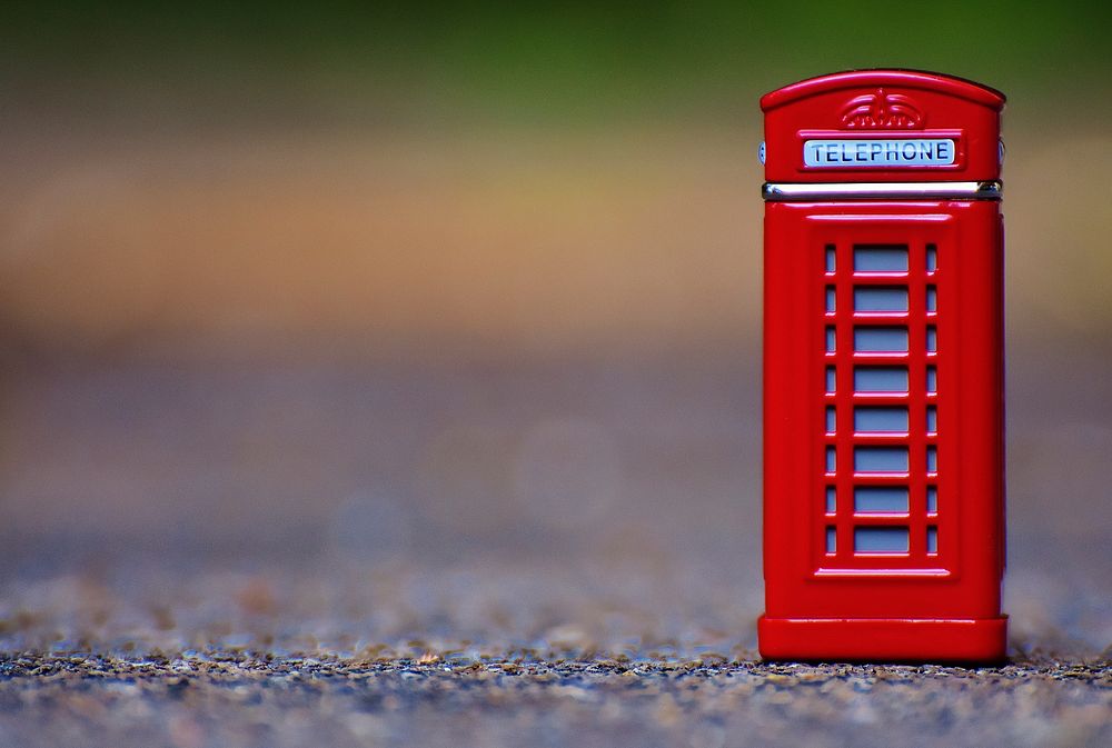 Iconic red phone booth in London, England. Free public domain CC0 photo.