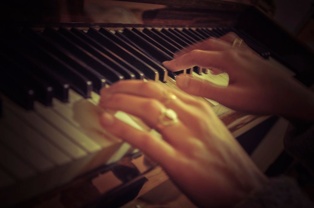 Pianist practicing on piano. Free public domain CC0 photo.