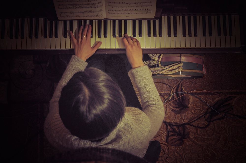 Pianist practicing on piano. Free public domain CC0 photo.