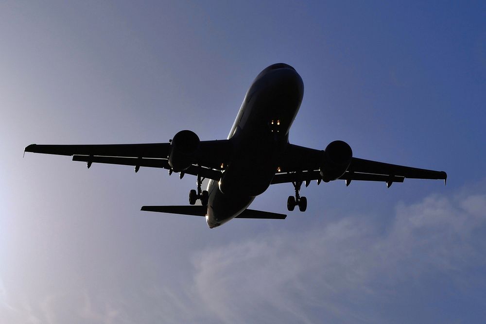 Airplane flying in the sky. Free public domain CC0 photo.