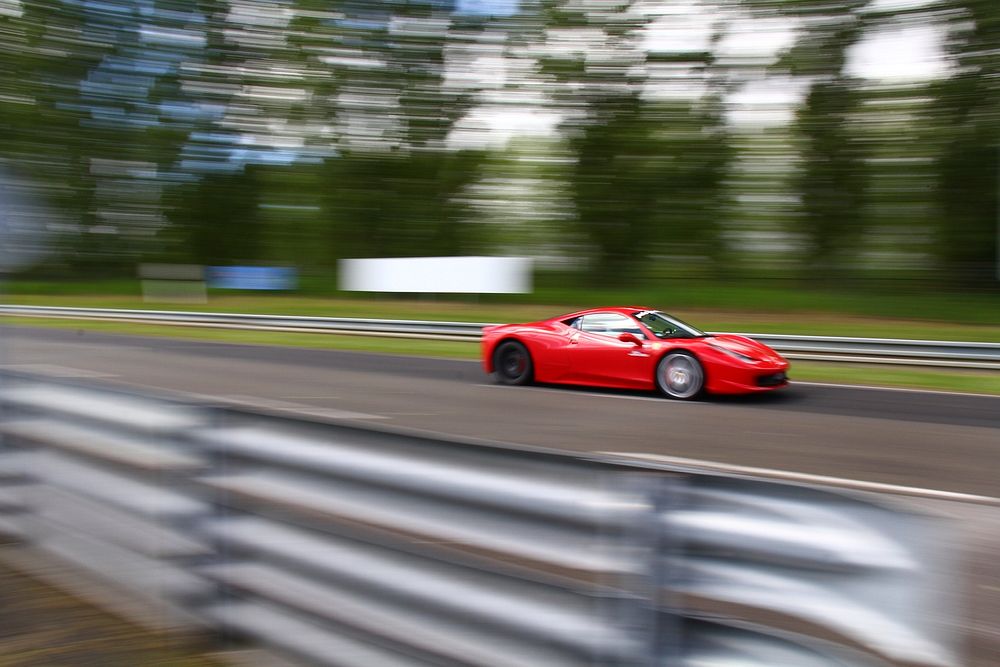 Sports car racing on the track. Free public domain CC0 photo.