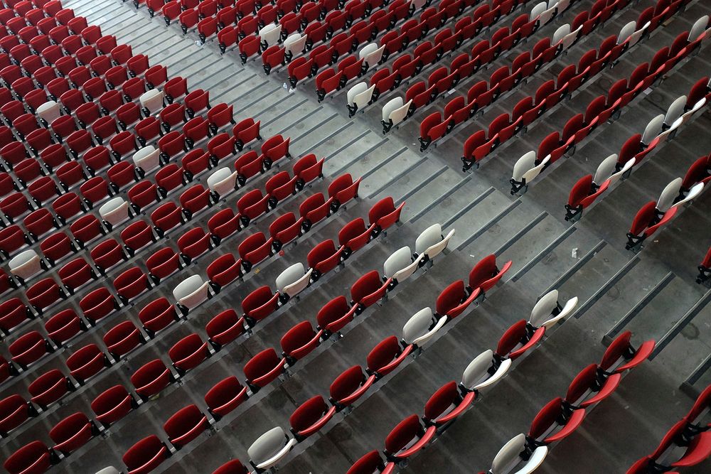 Red & white seats in arena. Free public domain CC0 photo.