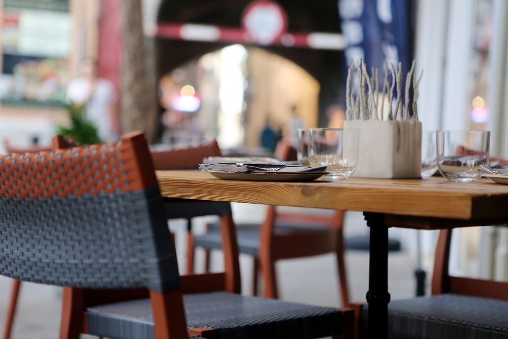 Outdoor restaurant tables. Free public domain CC0 photo.