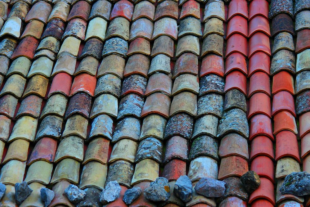 Stones on tile roof. Free public domain CC0 image.