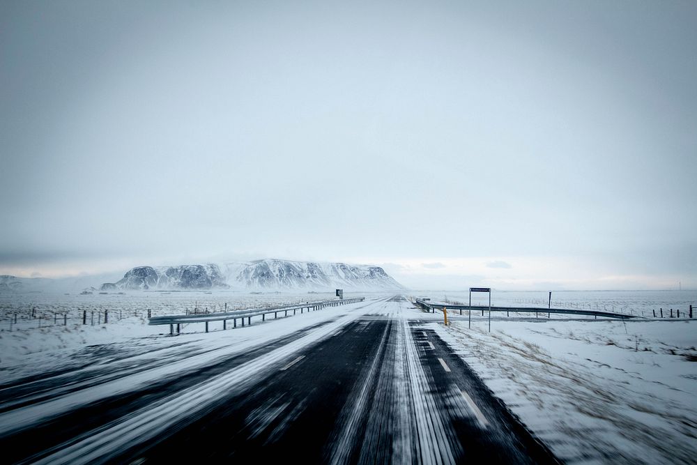 Empty road covered in snow. Free public domain CC0 image.
