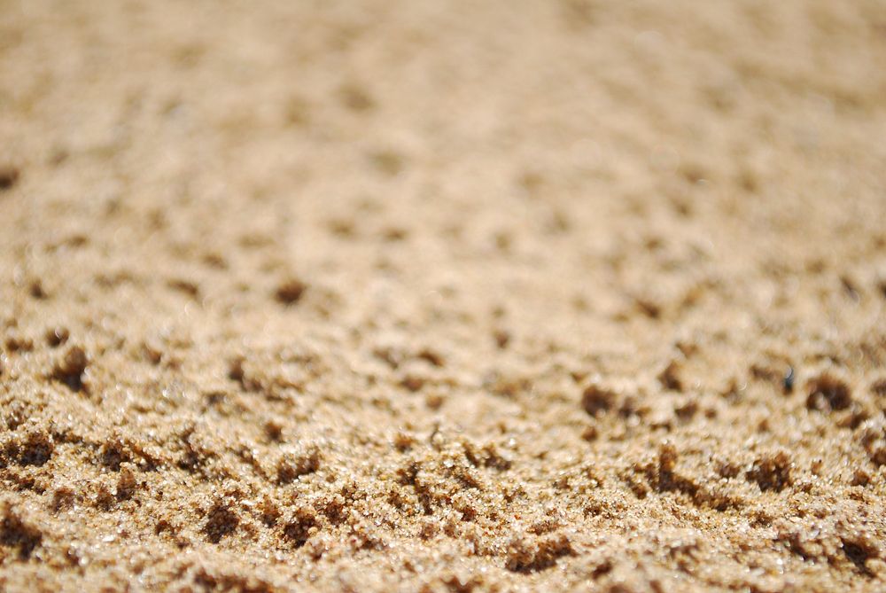 Close up beach sand. Free public domain CC0 photo.