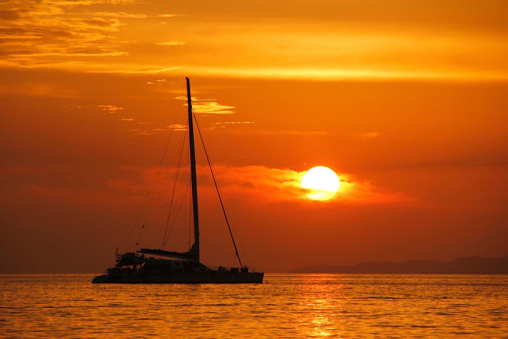 Yacht sailing in the sea. Free public domain CC0 photo.