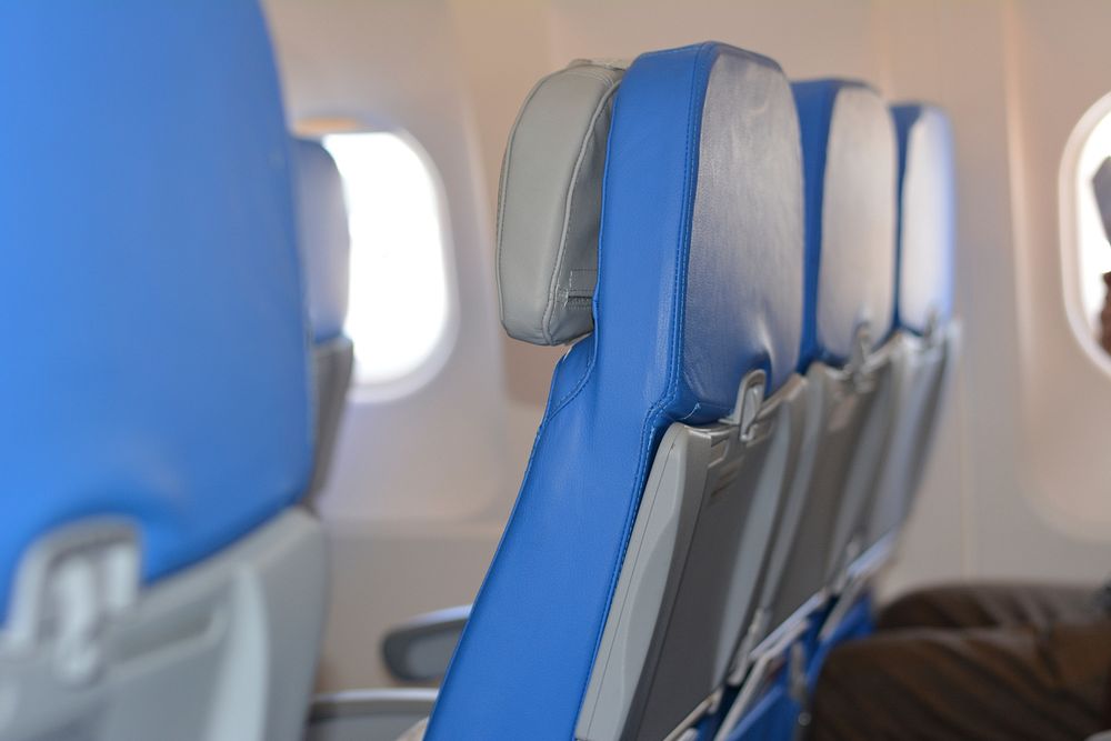 Passenger economy seats inside of a commercial plane. Free public domain CC0 photo