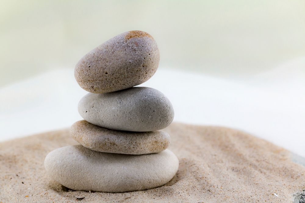 Balancing rock piles, beach sand. Free public domain CC0 photo