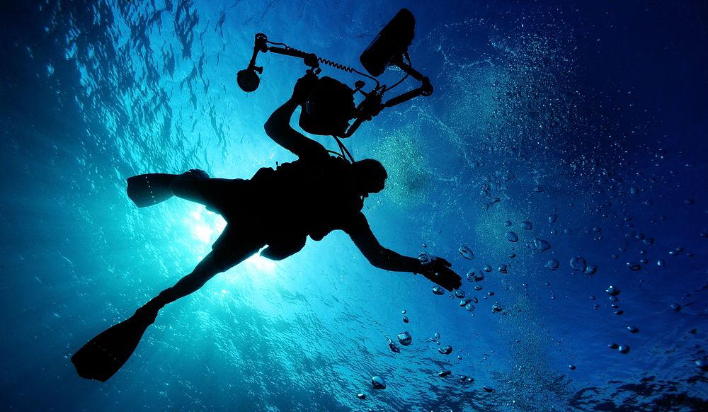 Scuba diver with camera. Free public domain CC0 image.