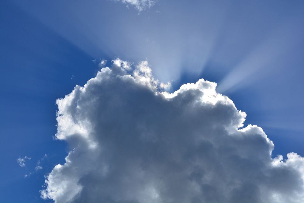 Cloudy sky background, sunbeam. Free public domain CC0 image.