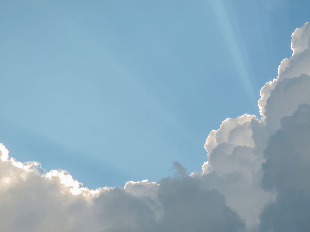 Cloudy sky with sunbeam background. Free public domain CC0 image.