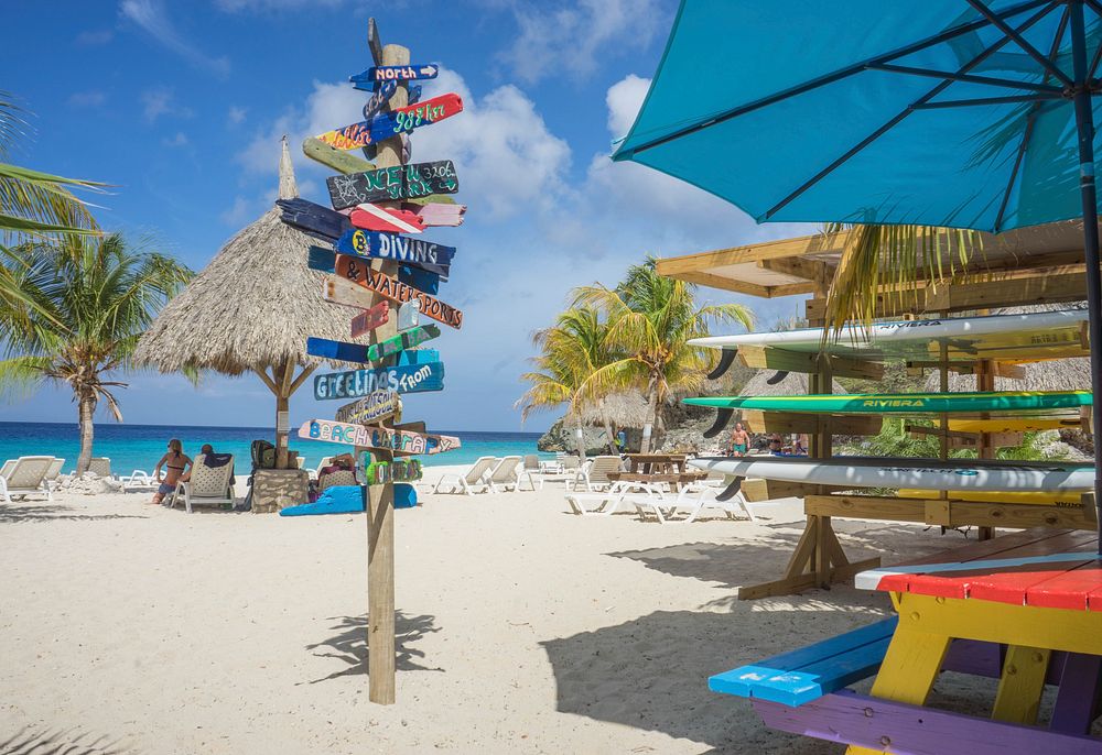 Beach colorful directions stand. Free public domain CC0 image.