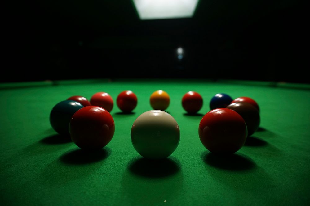 Closeup on solid pool balls on table. Free public domain CC0 image.